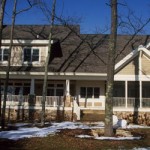 A house with partially melted snow outside